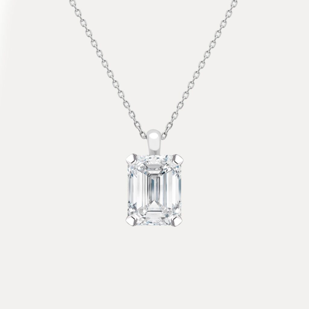 Sleek emerald cut diamond set on a fine platinum chain