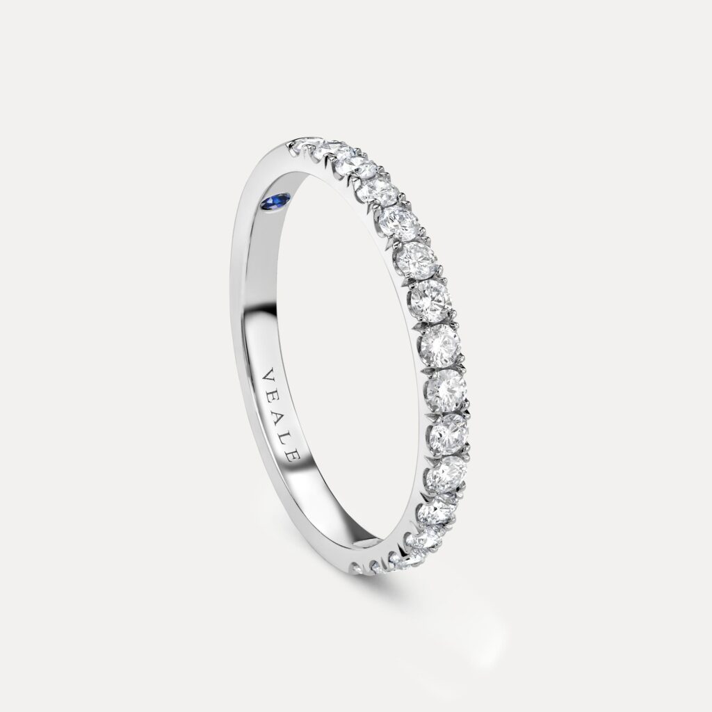 Side profile of classic castle setting diamond wedding ring