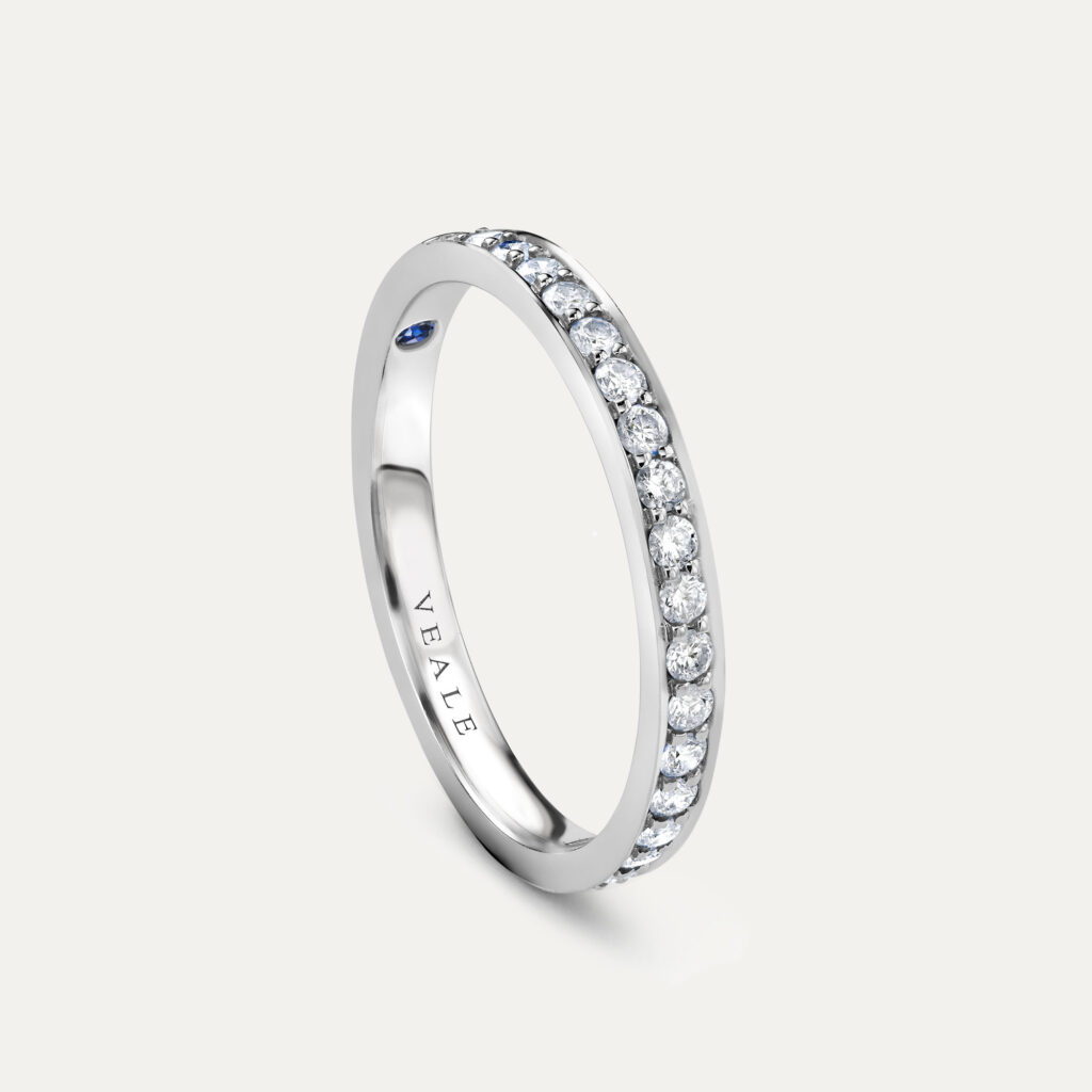 Side profile of classic pavé set diamond wedding ring
