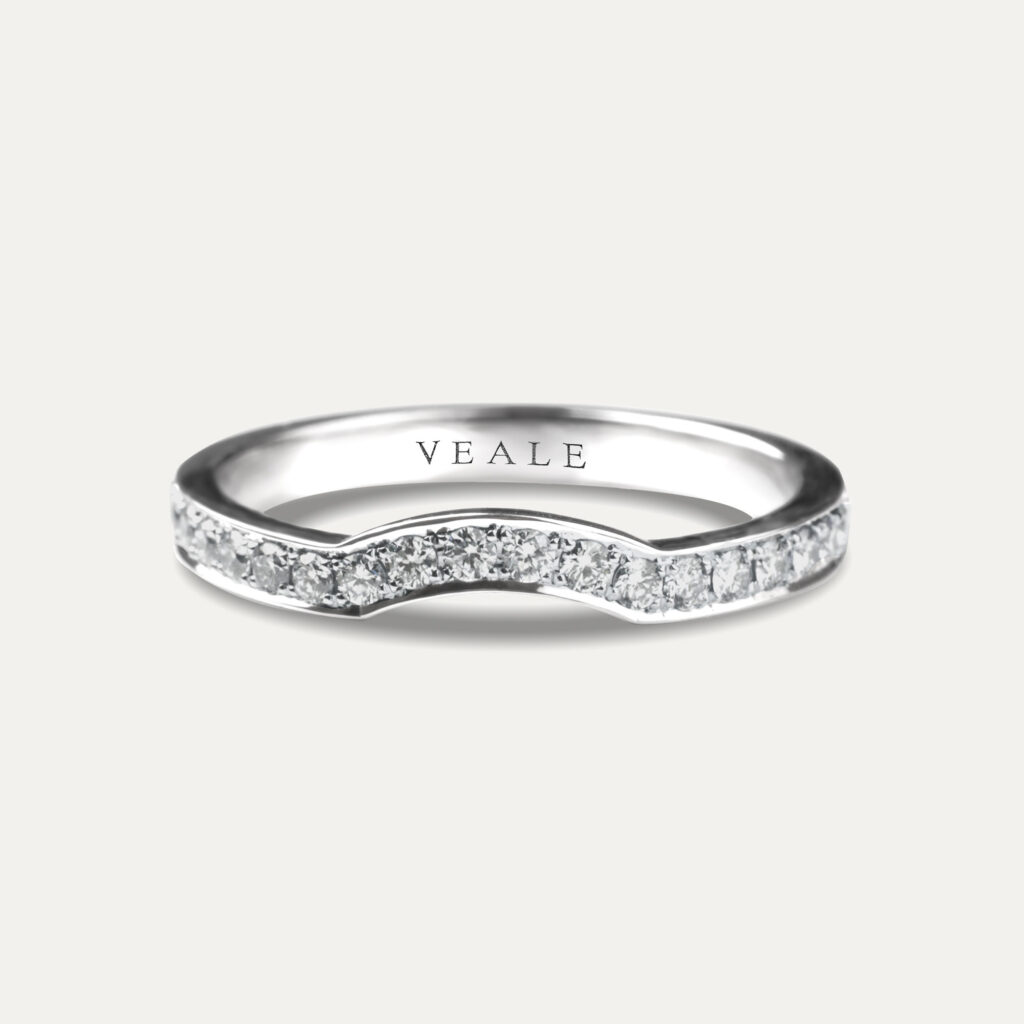 A shaped diamond wedding ring that goes around the shape of the diamond in the engagement ring