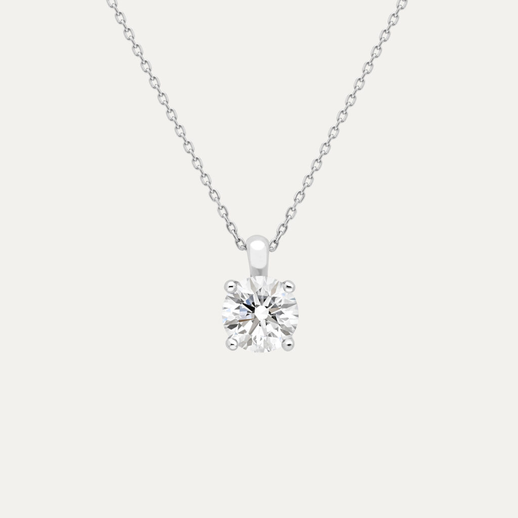 A round brilliant cut diamond set in a 4claw platinum setting on a fine trace chain