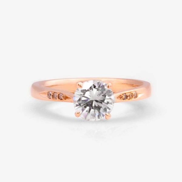 Rose gold solitaire ring featuring an inherited diamond center stone and accent cognac diamonds for a unique and sentimental design