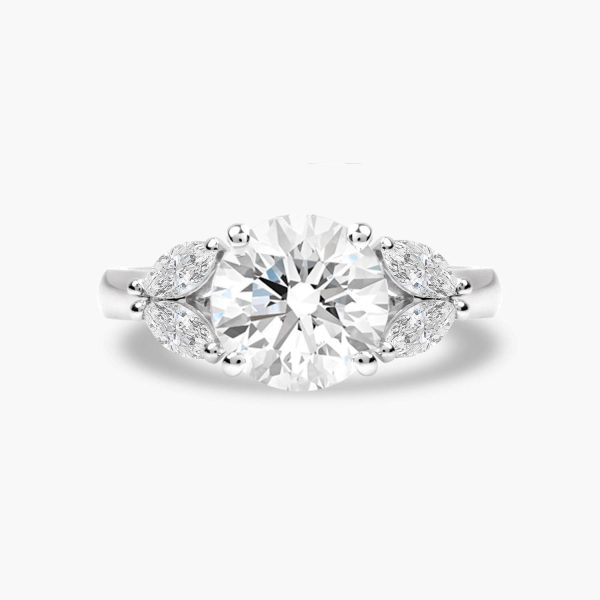 Round brilliant cut diamond held in platinum engagement ring with four marquise cut diamonds