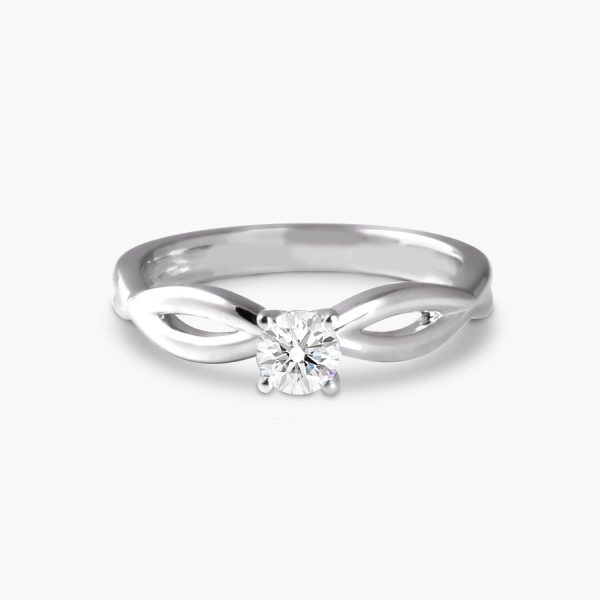 solitare diamond ring with crossing over shoulder on a platinum band
