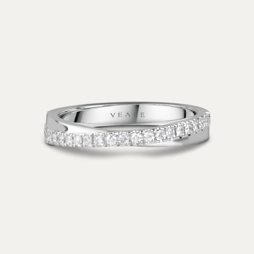 Platinum interlocking band forming a sculptural diamond wedding ring
