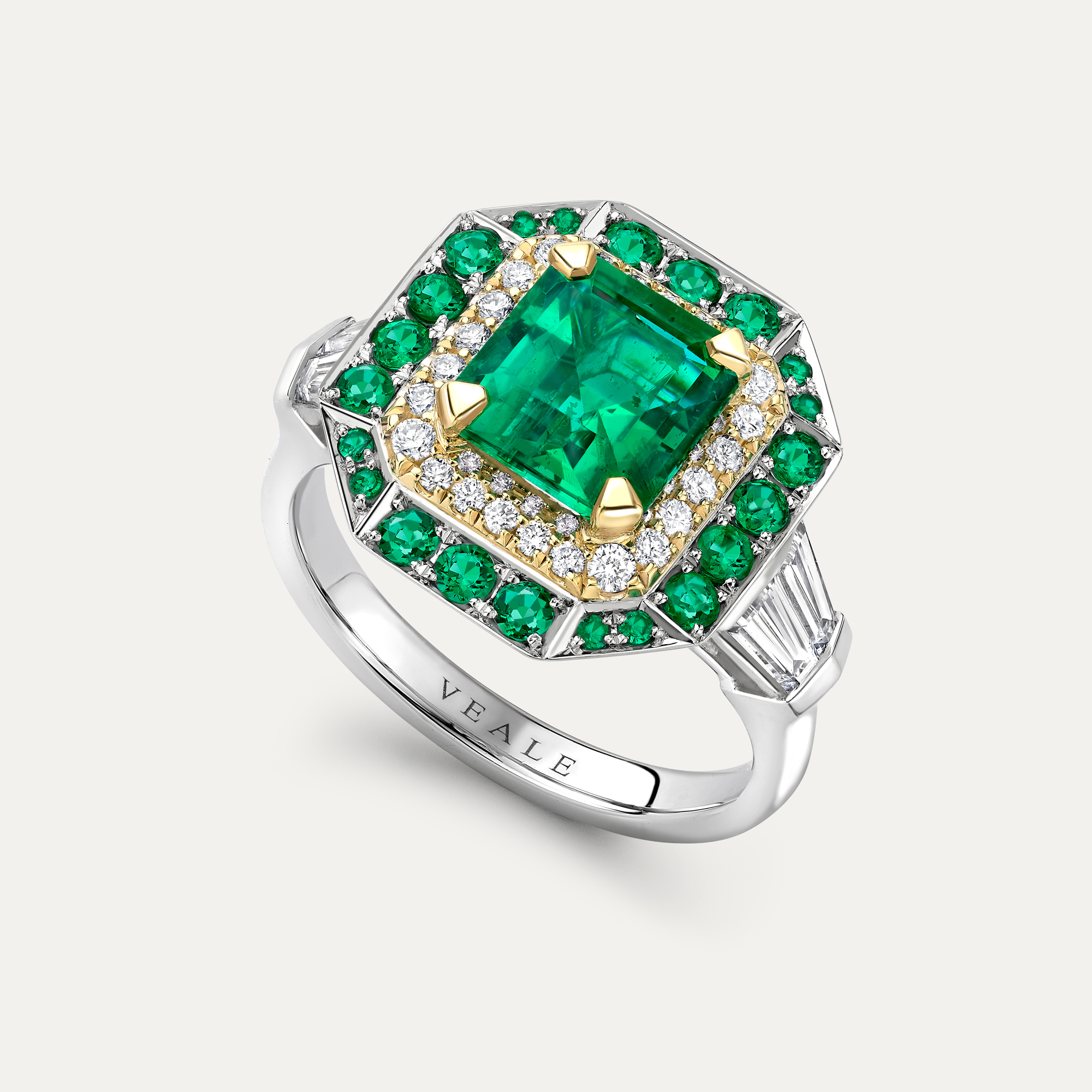Emerald and diamond halo ring side view