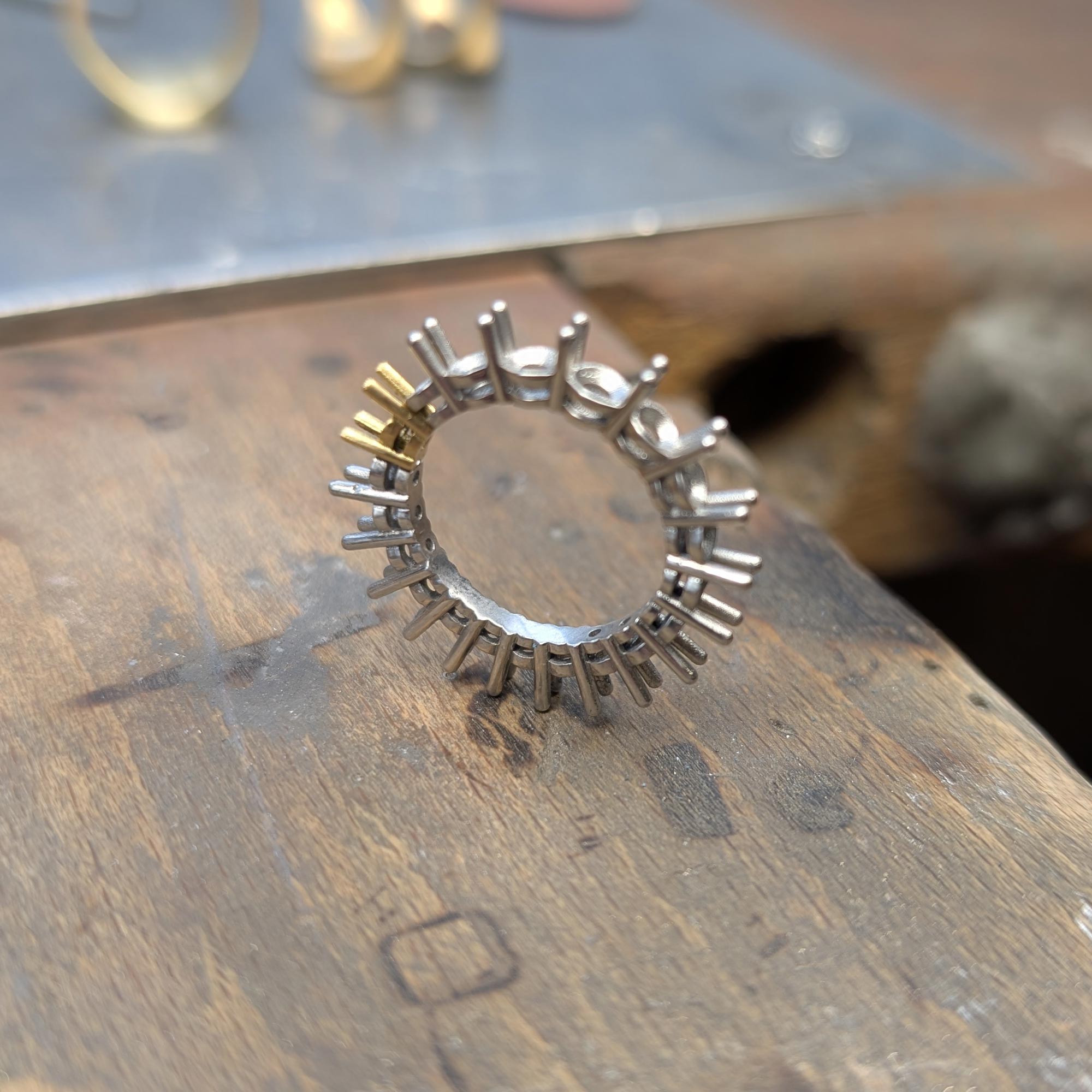 Full eternity ring on workbench being made