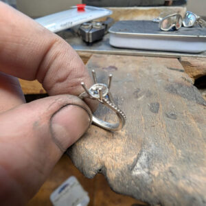 In the process of handcrafting a single stone engagement ring
