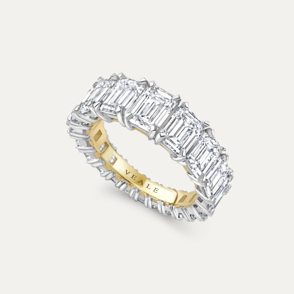 Emerald cut diamond full eternity ring crafted in platinum and 18ct yellow gold claw set graduated | Veale fine jewellery
