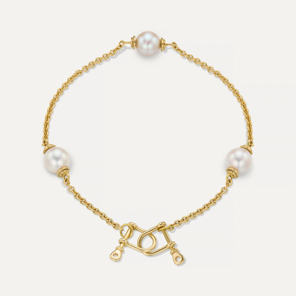 Gold pearl chain bracelet with Akoya pearls and sea inspired shackles